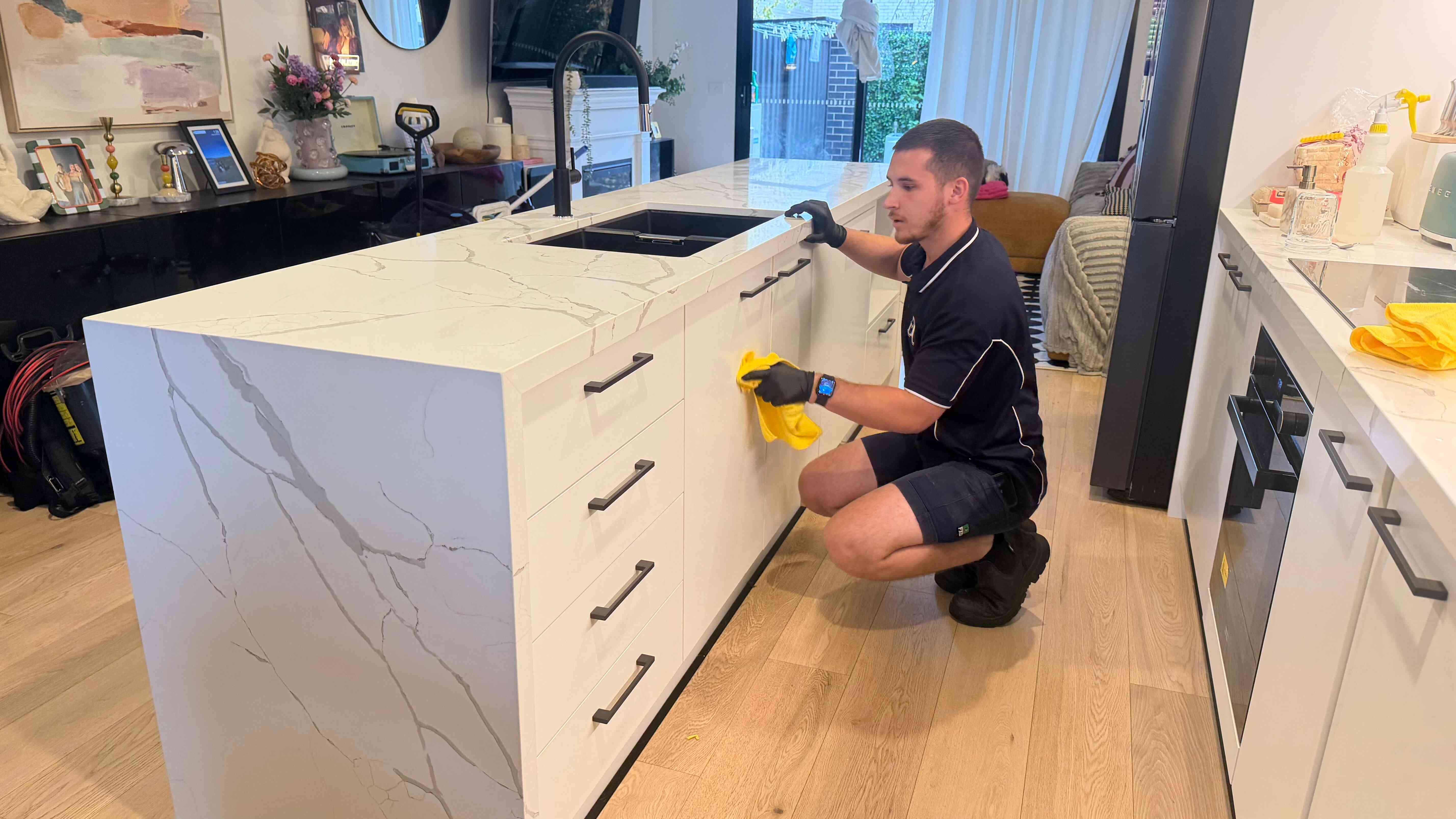 Gleam Clean Co. cleaner detailing a kitchen